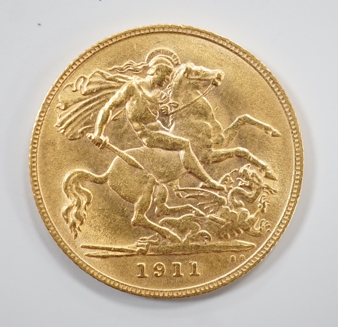 A George V 1911 gold half sovereign.